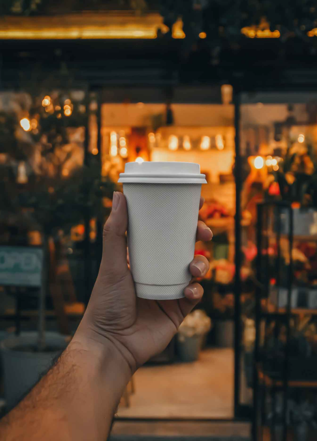 Coffee Cup in Hand Mockup