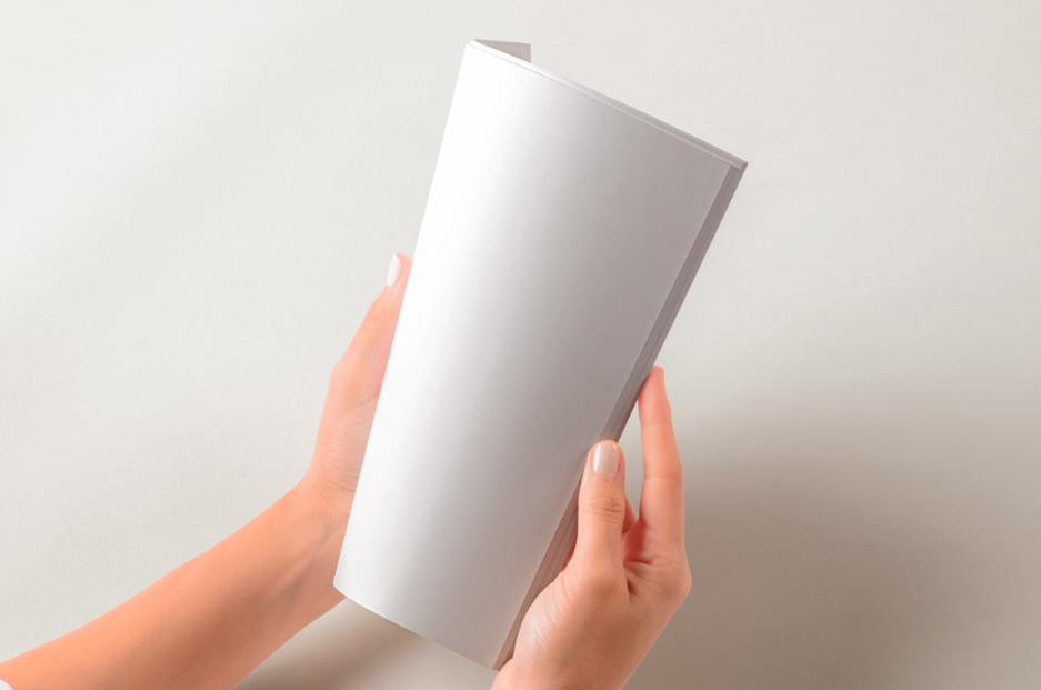Hands Holding Folded Catalog Magazine PSD Mockup