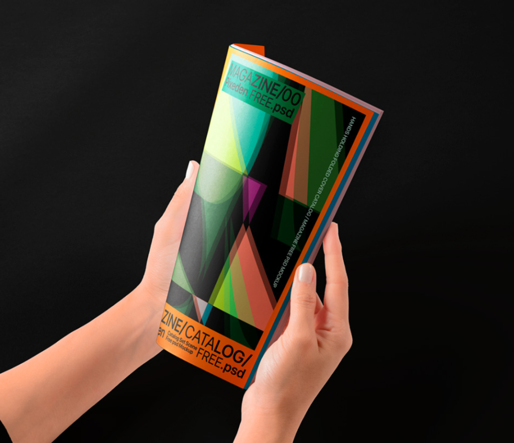 Hands Holding Folded Catalog Magazine PSD Mockup
