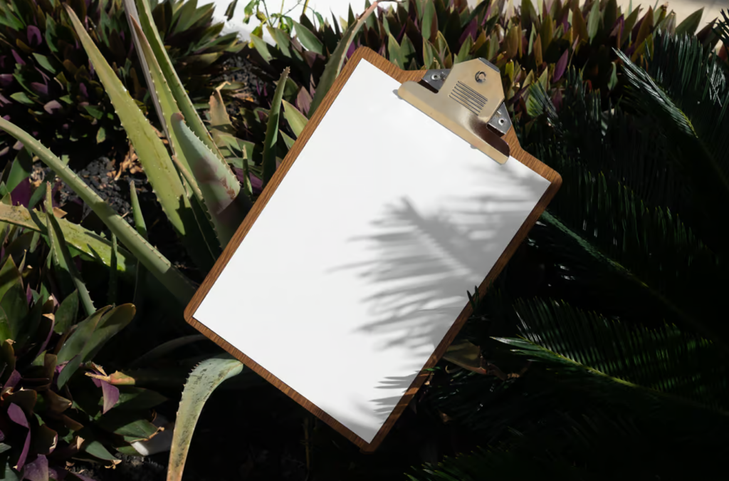 Laying Menu Between Flowers Mockup Artistic Presentation