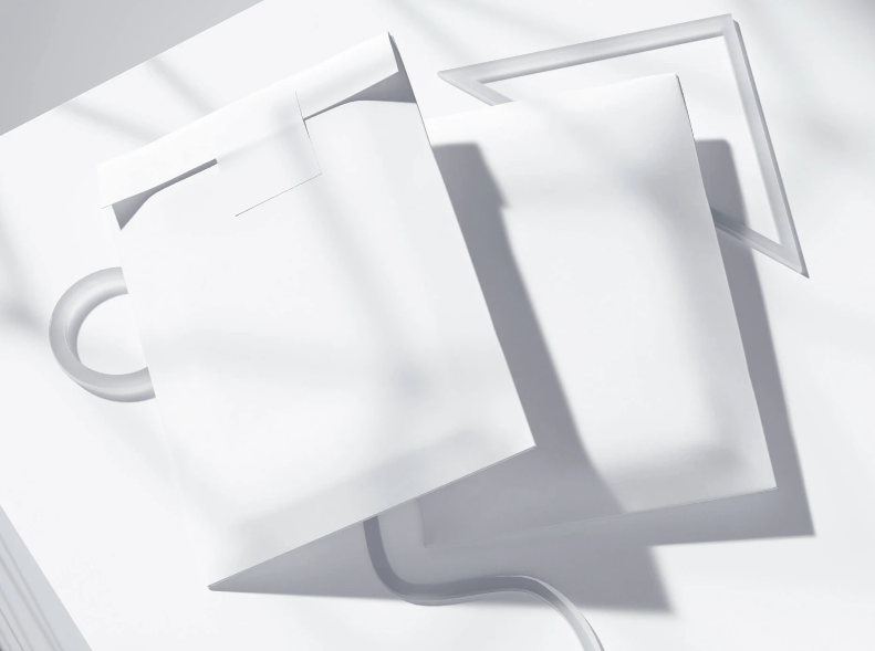 Two Envelope Mockups on a Gray Surface