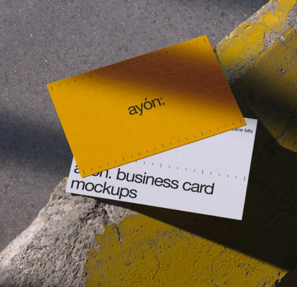 Two Overlapping Business Card Mockups on Concrete Surface