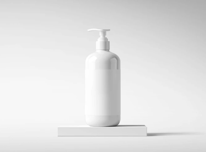 Free Lotion Bottle Mockup on White Platform Cosmetic Packaging PSD
