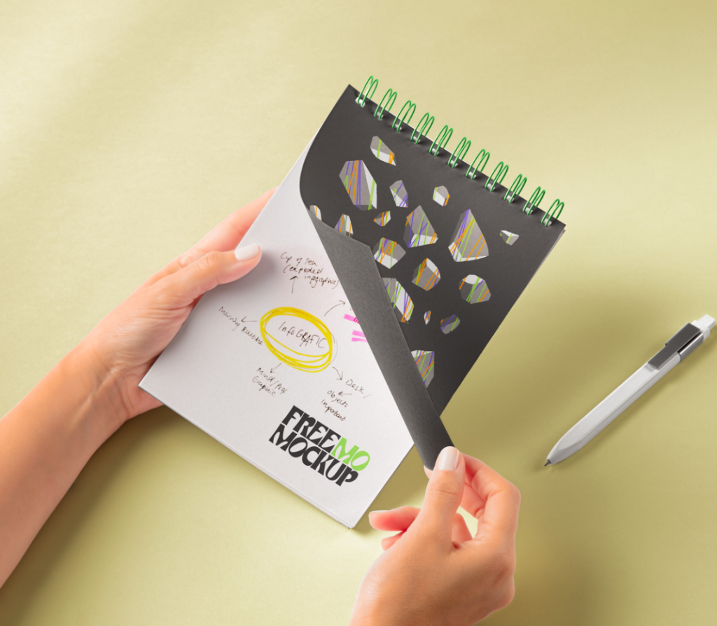 Hands Holding Spiral notebook PSD Mockup