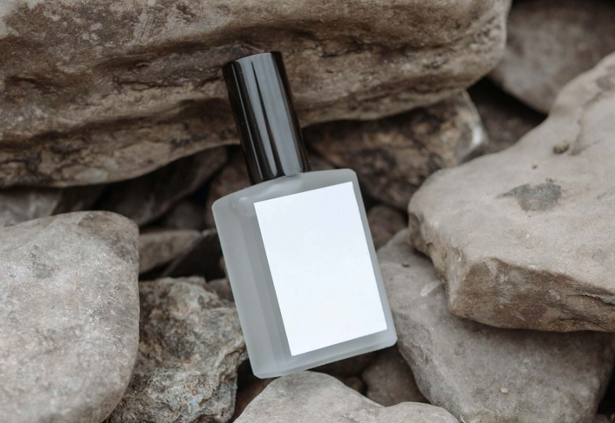 Perfume Bottle on Rocks Mockup PSD