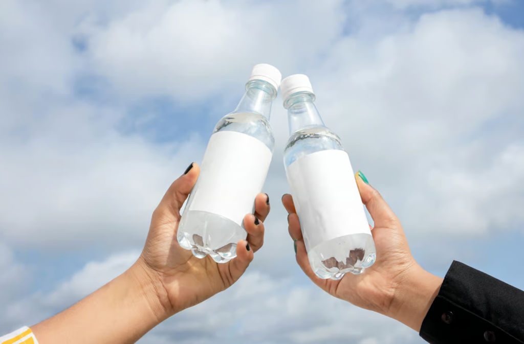 Two Bottle in Hand Mockup Designs Realistic Visuals