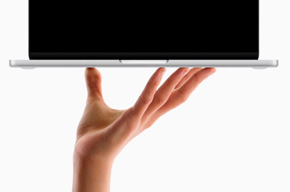 Hand Held MacBook neo Free PSD Mockup