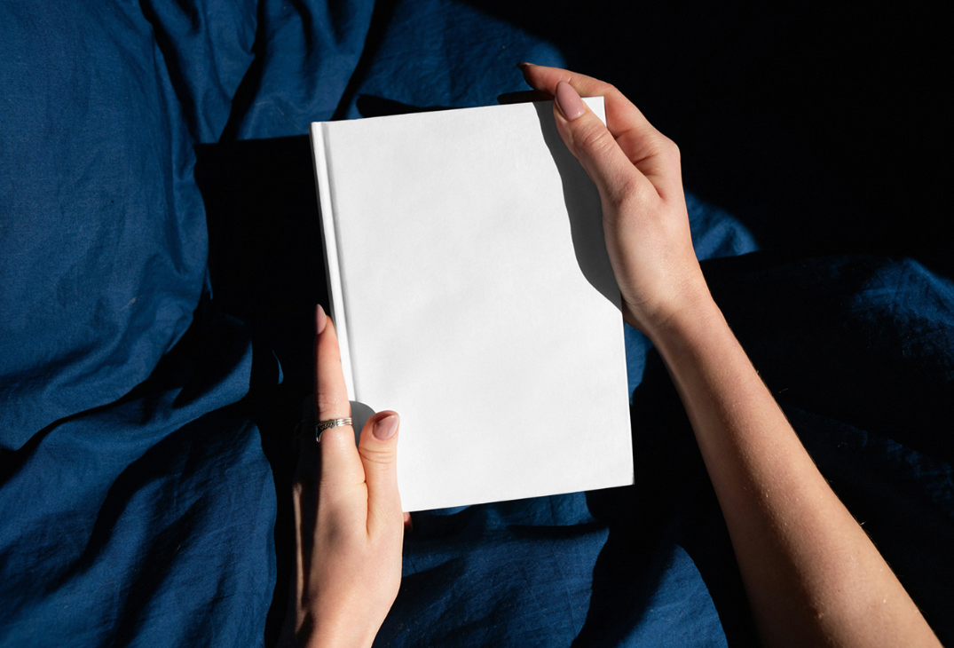 Free Woman Holding Book PSD Mockup