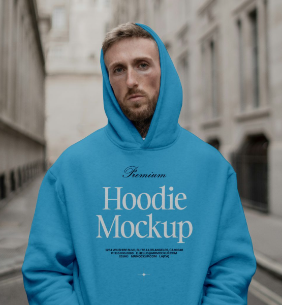 Men Wearing Hoodie Against The city Mockup