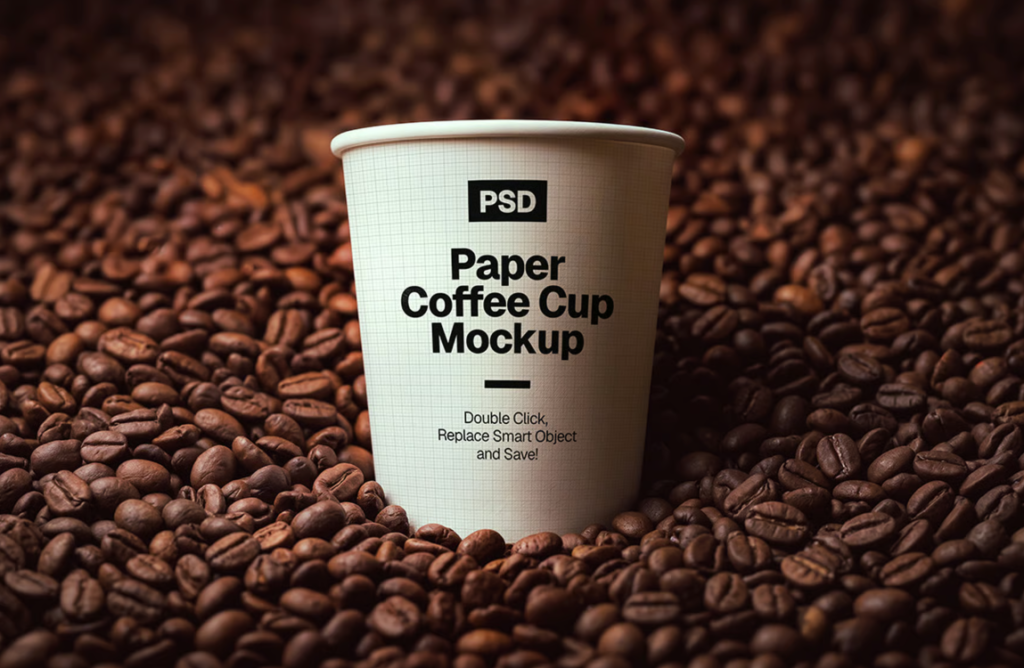 Paper coffee cup Mockup on Roasted coffee Beans